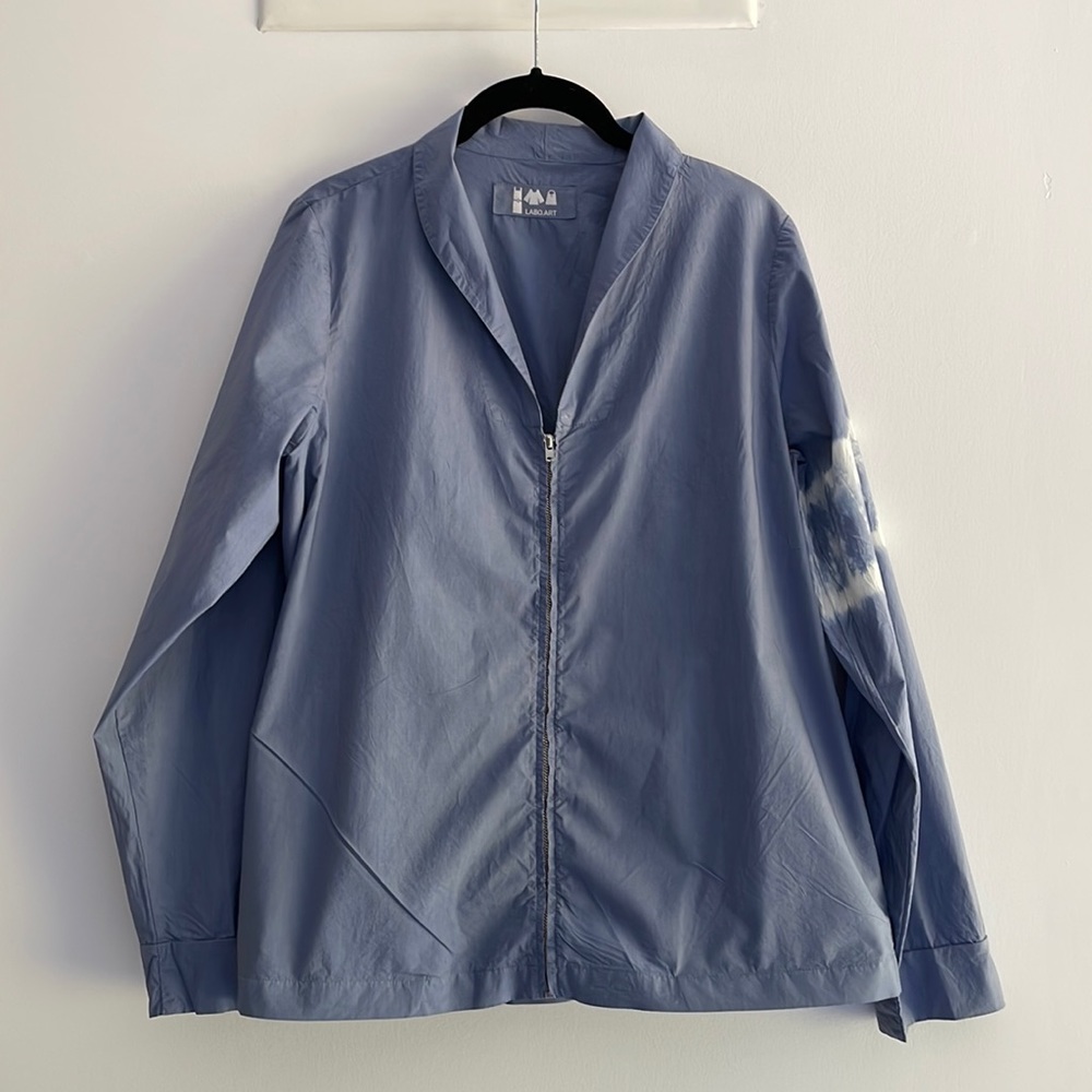 LABO.ART slate blue cotton windbreaker with white tie dye sleeve.